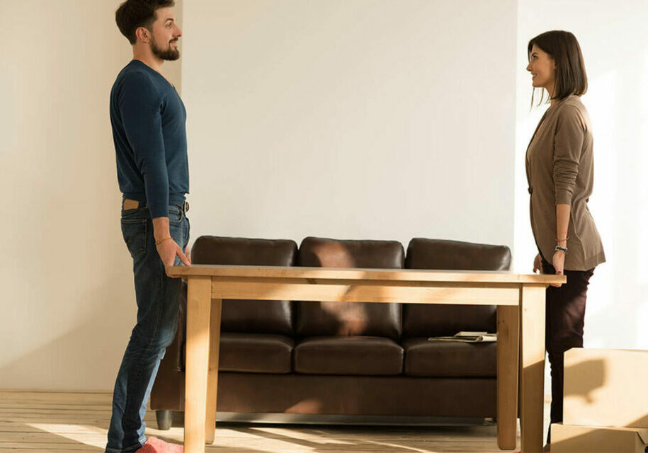 before installation, couple removing table | Fovama Oriental Rugs & Carpets in Scarsdale, NY