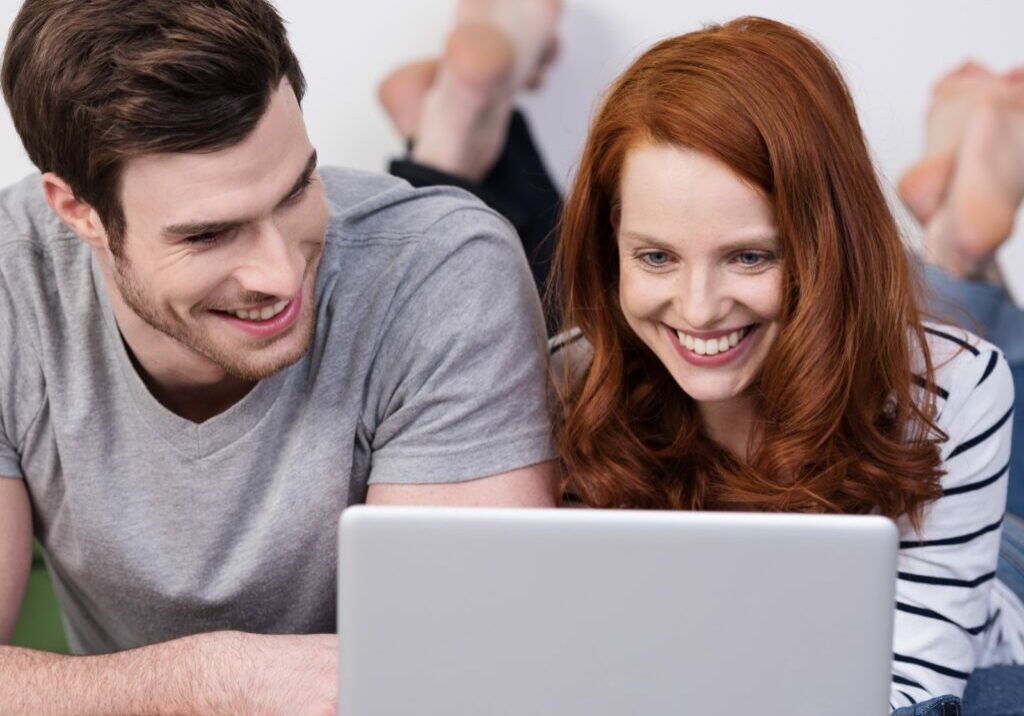 virtual consultation, couple looking at laptop | Fovama Oriental Rugs & Carpets in Scarsdale, NY